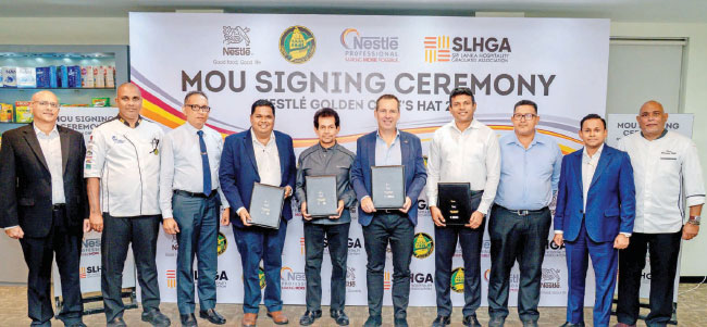Bernie Stefan Managing Director, Nestlé Lanka, with Chef Gerard Mendis Chairman Chefs Guild of Lanka, Patrick Pereira President Sri Lanka Hotel Schools Graduates Association and Maduranga Perera Assistant Director Nestlé Professional, Nestlé Lanka at the MoU signing with other officials.
